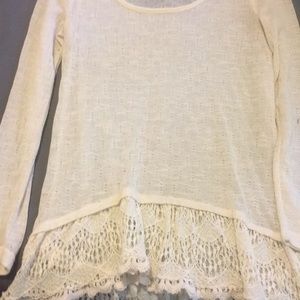 Cream colored long sleeve top